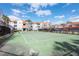 Tennis court at condo community with nearby buildings and landscaping at 18001 Richmond Place Dr # 1032, Tampa, FL 33647