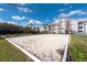 Volleyball court at condo community with nearby buildings and landscaping at 18001 Richmond Place Dr # 1032, Tampa, FL 33647