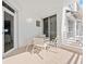 Balcony with table and chairs for outdoor dining and relaxation at 2410 Harbourside Dr # 142, Longboat Key, FL 34228