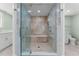 Well-lit bathroom featuring a glass shower and a modern vanity with ample storage space at 2410 Harbourside Dr # 142, Longboat Key, FL 34228