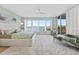 Tranquil bedroom with water views, a plush bed, and a private balcony for relaxing at 2410 Harbourside Dr # 142, Longboat Key, FL 34228