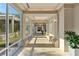 Bright hallway with large windows offering scenic views and letting in ample natural light at 2410 Harbourside Dr # 142, Longboat Key, FL 34228
