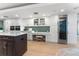 Contemporary kitchen features white cabinets, sleek countertops, and stainless steel appliances at 2410 Harbourside Dr # 142, Longboat Key, FL 34228