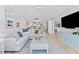 Spacious living room featuring comfortable seating, sleek decor, and an open layout at 2410 Harbourside Dr # 142, Longboat Key, FL 34228