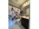Neutral bathroom featuring a decorative shower curtain and modern fixtures at 2465 Northside Dr # 604, Clearwater, FL 33761