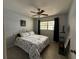 Serene bedroom featuring neutral decor, tile flooring, and a ceiling fan for added comfort at 2465 Northside Dr # 604, Clearwater, FL 33761