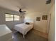 Bright bedroom with neutral tones, tiled floors, and a ceiling fan for comfort at 2465 Northside Dr # 604, Clearwater, FL 33761