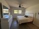 Cozy bedroom with a ceiling fan, tiled floors, a neutral color scheme, and ample natural light at 2465 Northside Dr # 604, Clearwater, FL 33761
