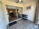 Sunlit Florida room with tile flooring, ceiling fan, and sliding glass doors to living area at 2465 Northside Dr # 604, Clearwater, FL 33761