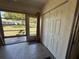 Bright sunroom boasts tile flooring, large windows with a view, and closet storage at 2465 Northside Dr # 604, Clearwater, FL 33761