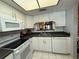 Efficient kitchen layout with white appliances at 2465 Northside Dr # 604, Clearwater, FL 33761