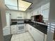Well-maintained kitchen equipped with white appliances and ample cabinet space at 2465 Northside Dr # 604, Clearwater, FL 33761