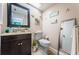 Cozy bathroom features a granite vanity, neutral colors, and decor with a beach theme at 2537 Royal Pines Cir # 19I, Clearwater, FL 33763