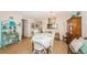 Bright and airy dining room with a decorative chandelier and seating for four at 2537 Royal Pines Cir # 19I, Clearwater, FL 33763