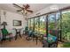Inviting Florida room with comfortable seating and views of lush greenery at 2537 Royal Pines Cir # 19I, Clearwater, FL 33763