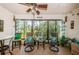 Bright Florida room featuring comfortable seating and tropical-themed decor at 2537 Royal Pines Cir # 19I, Clearwater, FL 33763