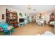 Bright living room featuring tile floors, beach decor, dining area, and chandelier lighting at 2537 Royal Pines Cir # 19I, Clearwater, FL 33763