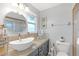 Bathroom with stylish vessel sink, granite counters, and attractive vanity at 27103 Frampton Ave Ave, Brooksville, FL 34602