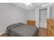 Bedroom with wood-look floors, ceiling fan, and two dressers at 27103 Frampton Ave Ave, Brooksville, FL 34602