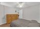 Bedroom with wood-look floors, ceiling fan, and dresser at 27103 Frampton Ave Ave, Brooksville, FL 34602