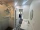 Modern vanity and shower combination with updated fixtures in updated bathroom at 300 S Highland Ave, Tarpon Springs, FL 34689