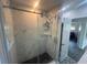 Walk-in shower, updated vanity, decorative flooring and modern hardware at 300 S Highland Ave, Tarpon Springs, FL 34689