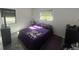 Cozy bedroom with natural light and comfortable furnishings, creating a peaceful retreat at 300 S Highland Ave, Tarpon Springs, FL 34689
