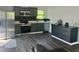 Modern kitchen with stainless steel appliances and sleek gray cabinetry at 300 S Highland Ave, Tarpon Springs, FL 34689