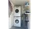 Functional laundry area with stacked washer and dryer, maximizing space efficiency at 300 S Highland Ave, Tarpon Springs, FL 34689