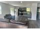 Open-concept area connecting the living room and kitchen with stainless appliances at 300 S Highland Ave, Tarpon Springs, FL 34689