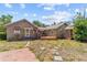 Property with two houses, one wooden deck, concrete area, and stone walkway at 3124 9Th N Ave, St Petersburg, FL 33713