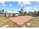 Spacious backyard featuring a concrete slab, tent-like structure, and brick barbeque at 3124 9Th N Ave, St Petersburg, FL 33713