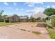 Backyard featuring a large concrete slab with tent-like structure, and two houses at 3124 9Th N Ave, St Petersburg, FL 33713