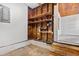 Unfinished basement with shelving, exposed pipes, and stairs leading to the upper level at 3124 9Th N Ave, St Petersburg, FL 33713