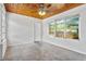 Bright bedroom featuring gray carpet, white walls, wooden ceiling and three windows at 3124 9Th N Ave, St Petersburg, FL 33713