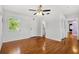 Bright bedroom with hardwood floors, a ceiling fan, and access to a bathroom at 3124 9Th N Ave, St Petersburg, FL 33713