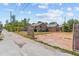 Property featuring 2 houses, a large concrete slab, and a grassy area at 3124 9Th N Ave, St Petersburg, FL 33713
