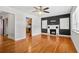 Bright living room featuring hardwood floors, a ceiling fan, fireplace, and lots of natural light at 3124 9Th N Ave, St Petersburg, FL 33713