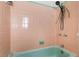 Bright shower stall with green tile, shower head and vintage fixtures at 3124 9Th N Ave, St Petersburg, FL 33713