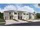 Beautiful townhome with a two-car garage and landscaped front yard at 31279 Paper Birch St, Wesley Chapel, FL 33545