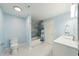 Well-lit bathroom with blue walls, and shower with grey tiling at 345 Bayshore Blvd # 1502, Tampa, FL 33606