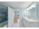 Bathroom featuring modern vanity, shower, and access to bedroom at 345 Bayshore Blvd # 1502, Tampa, FL 33606