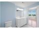 A bright bathroom with a large vanity with white countertop and light blue walls at 345 Bayshore Blvd # 1502, Tampa, FL 33606