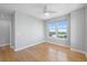 This spacious bedroom includes hardwood floors, bright light fixtures, and a ceiling fan at 345 Bayshore Blvd # 1502, Tampa, FL 33606