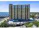 High-rise condo building featuring a covered parking and views of the water at 345 Bayshore Blvd # 1502, Tampa, FL 33606