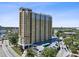 High-rise condo building featuring multiple balconies, well-maintained landscaping, and ample parking at 345 Bayshore Blvd # 1502, Tampa, FL 33606