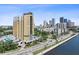Expansive aerial view of the condo building with city skyline, highlighting its desirable urban location and stunning views at 345 Bayshore Blvd # 1502, Tampa, FL 33606