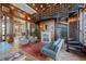 Elegant living room featuring a spiral staircase, fireplace, herringbone floors, and refined decor at 345 Bayshore Blvd # 1502, Tampa, FL 33606