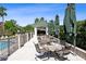 Outdoor patio area with table, chairs, and umbrellas, perfect for relaxation and enjoying the view at 345 Bayshore Blvd # 1502, Tampa, FL 33606
