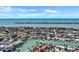 Expansive aerial view captures a neighborhood with waterfront homes and boat docks on a sunny day at 350 Pinellas Bayway S # 2, St Petersburg, FL 33715